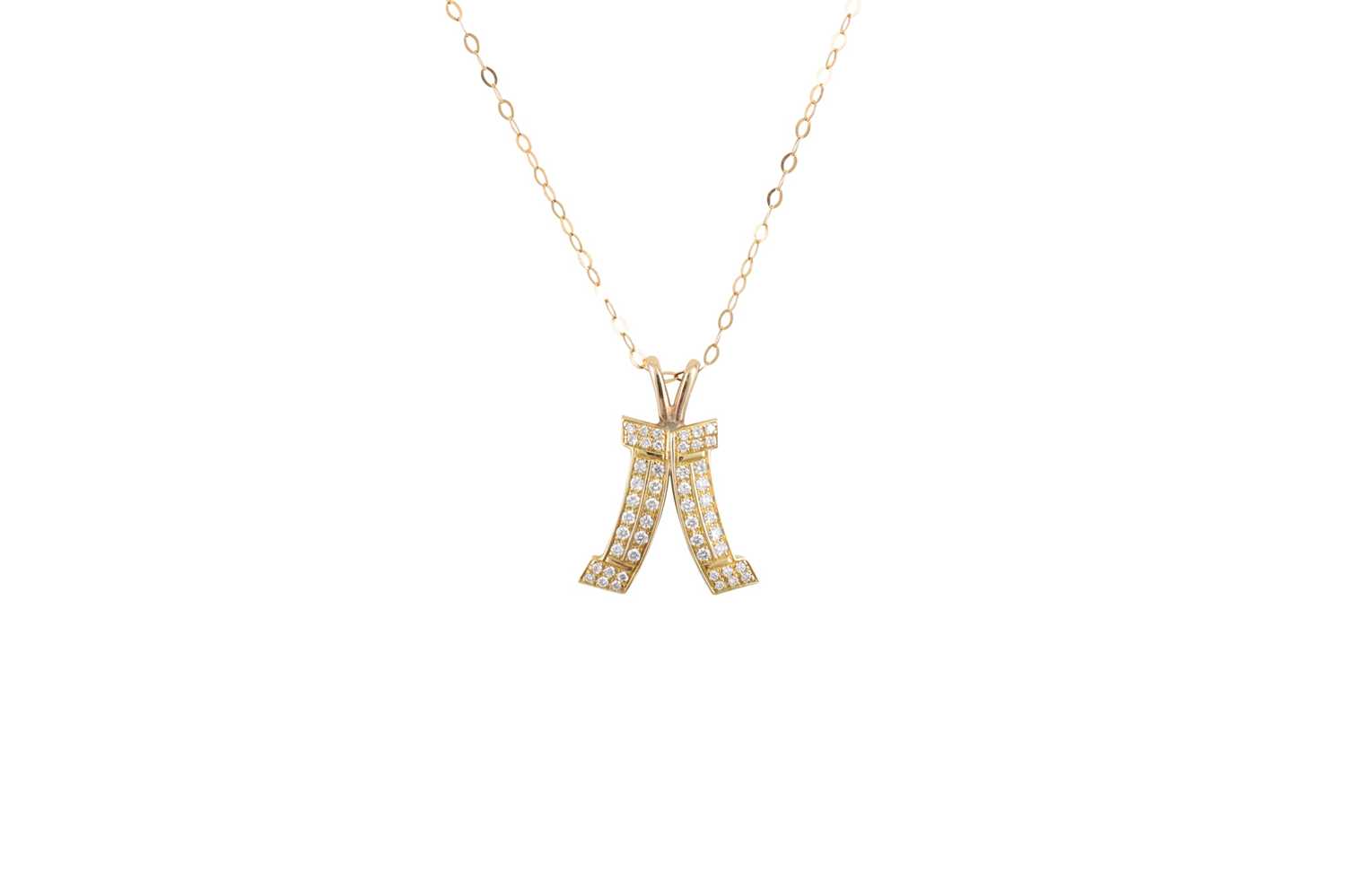 Lot 192 - A DIAMOND AND 18CT GOLD PENDANT, shaped form,...