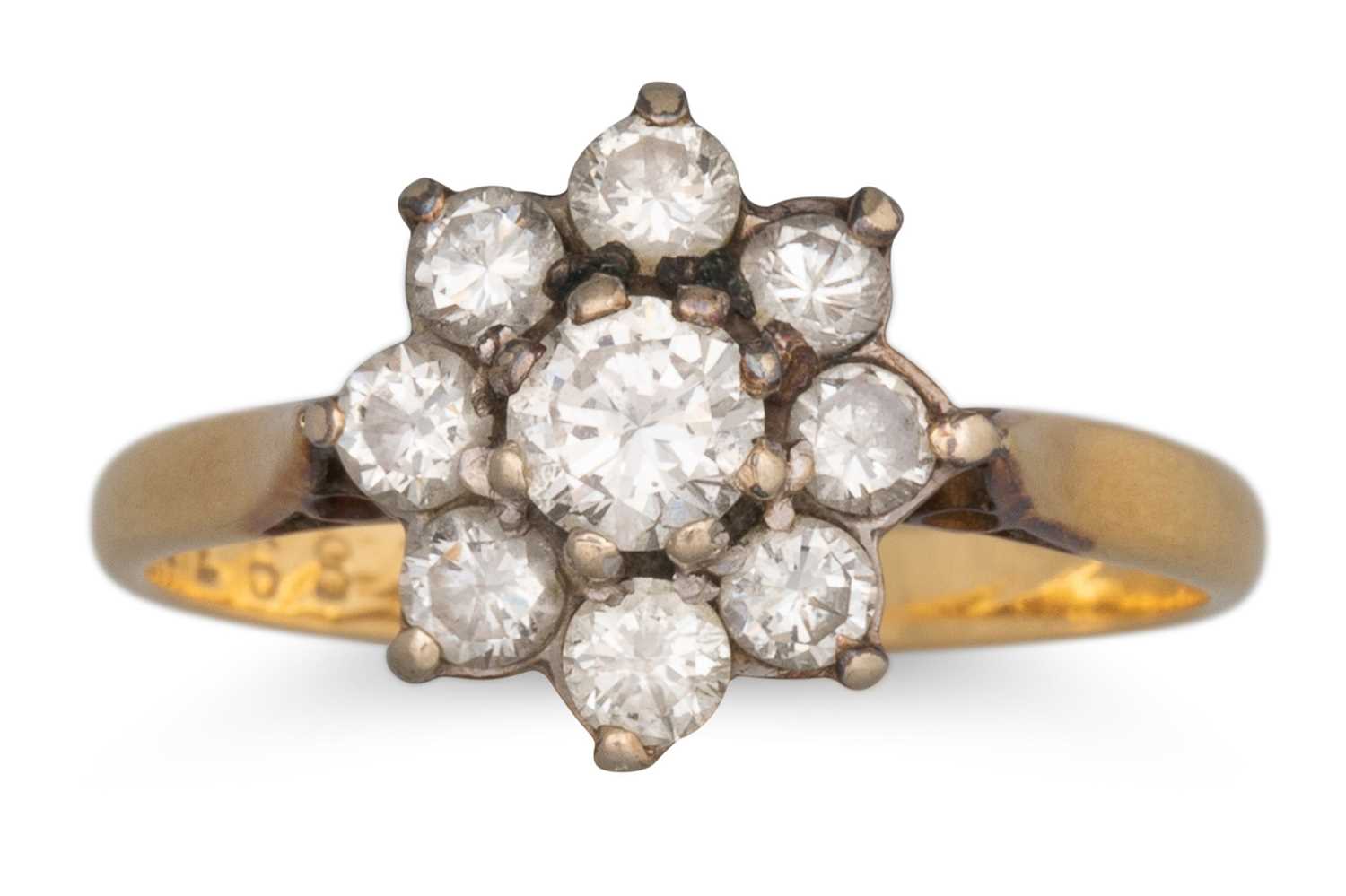Lot 53 - A DIAMOND DAISY CLUSTER DRESS RING, mounted in...