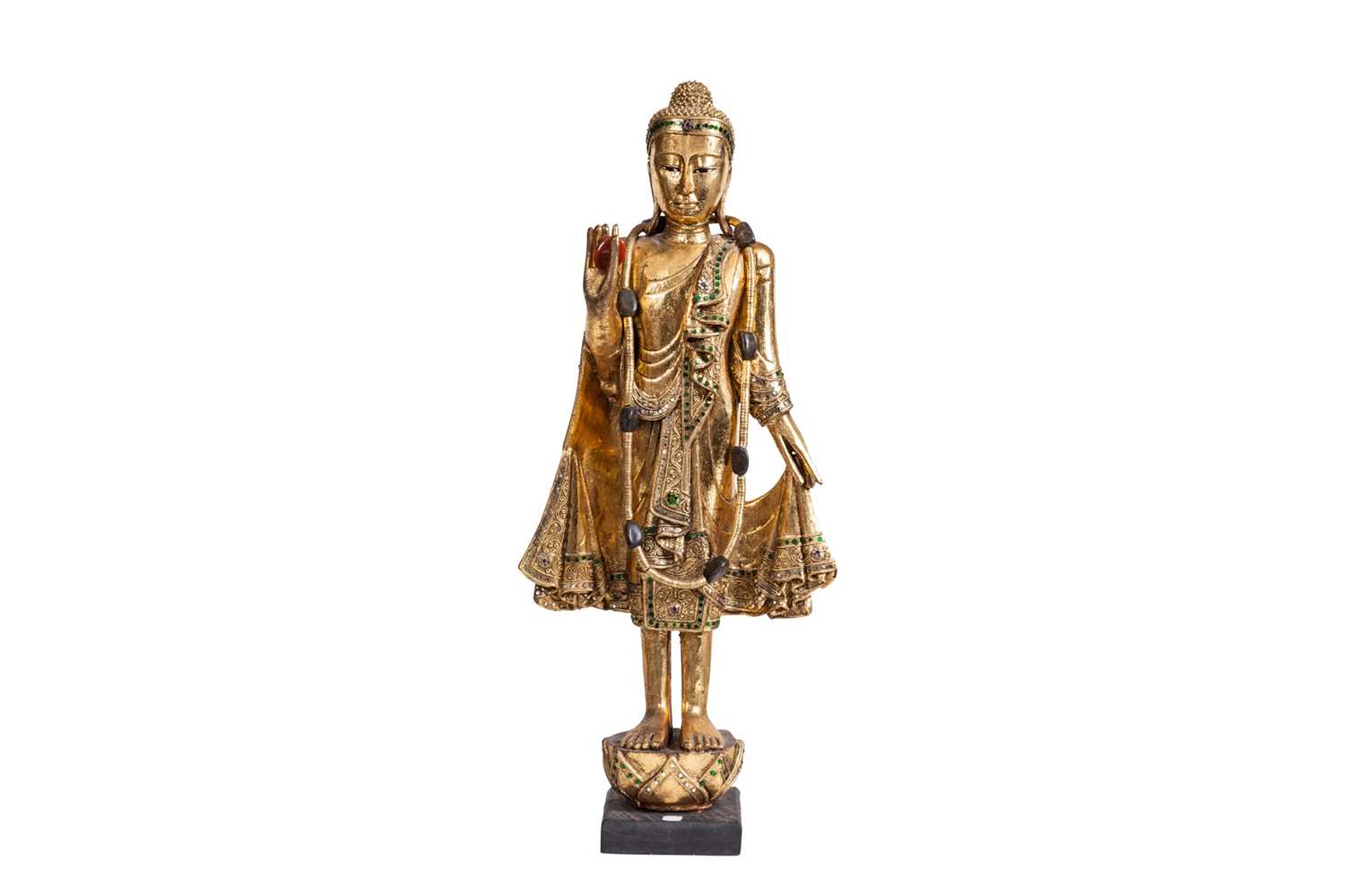 Lot 182 - A MODREN CARVED AND GILT STANDING BUDDA, with...
