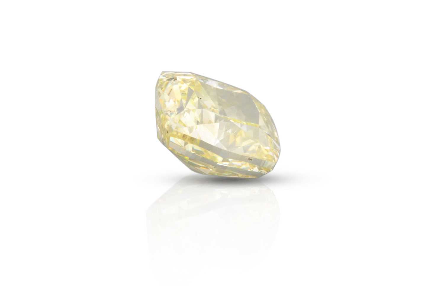 Lot 122 - A LOOSE FANCY YELLOW RADIANT CUT DIAMOND....