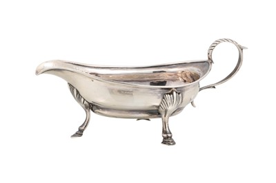 Lot 536 - A GEORGE III ANTIQUE SILVER SAUCE BOAT, raised...