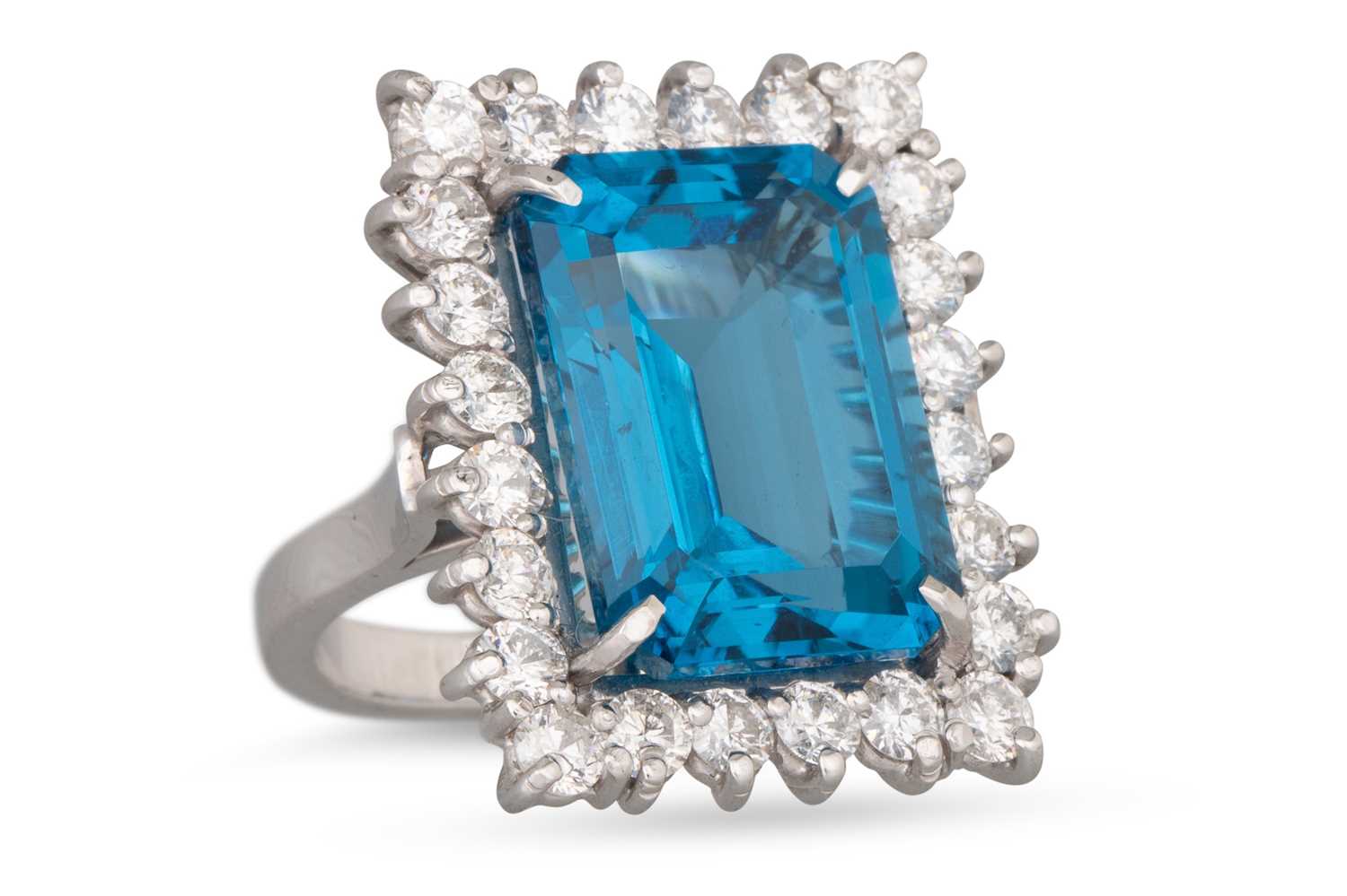 Lot 395 - A TOPAZ AND DIAMOND CLUSTER RING, the