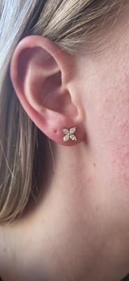 Lot 141 - A PAIR OF DIAMOND CLUSTER EARRINGS, of floral...