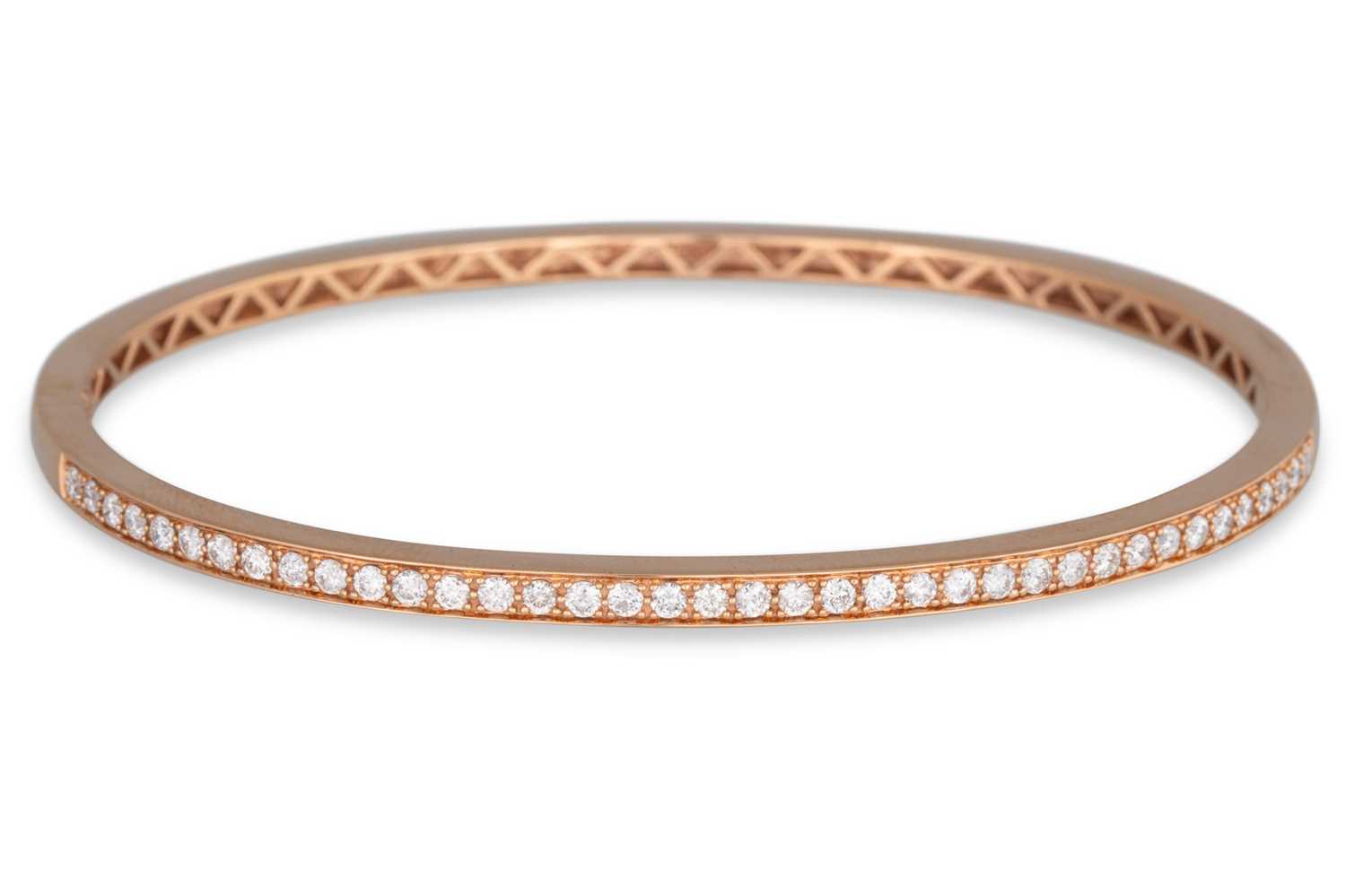 Lot 223 - A DIAMOND SET BANGLE, the brilliant cut...