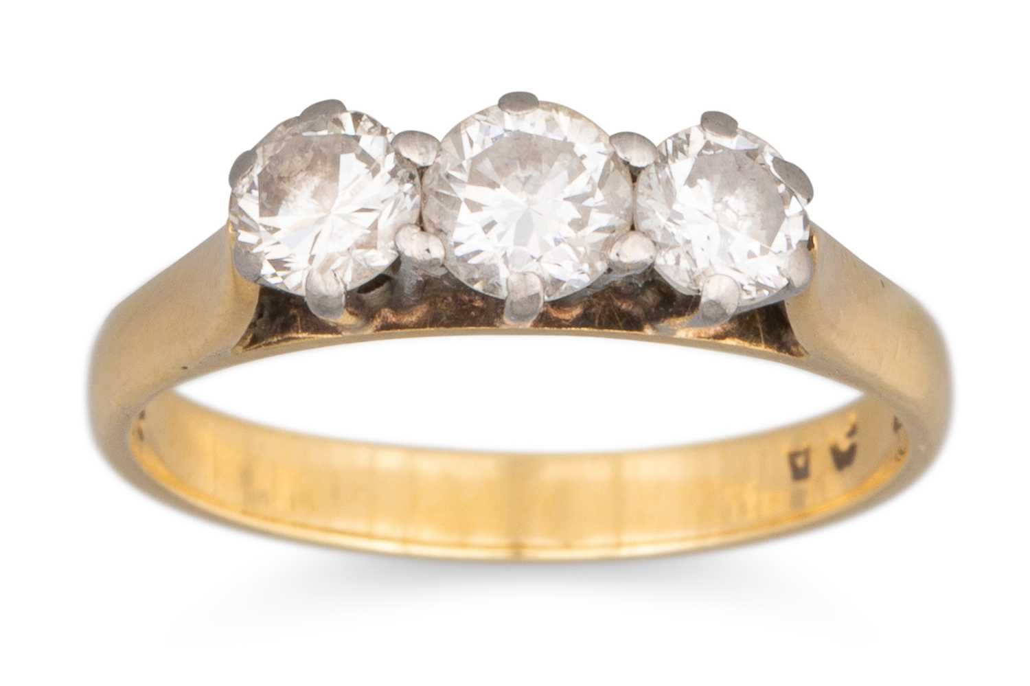 Lot 63 - A DIAMOND THREE STONE RING, the round...