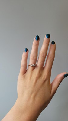 Lot 63 - A DIAMOND THREE STONE RING, the round...