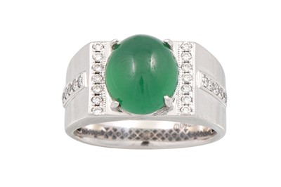 Lot 255 - A CABOCHON EMERALD AND DIAMOND RING, the oval...