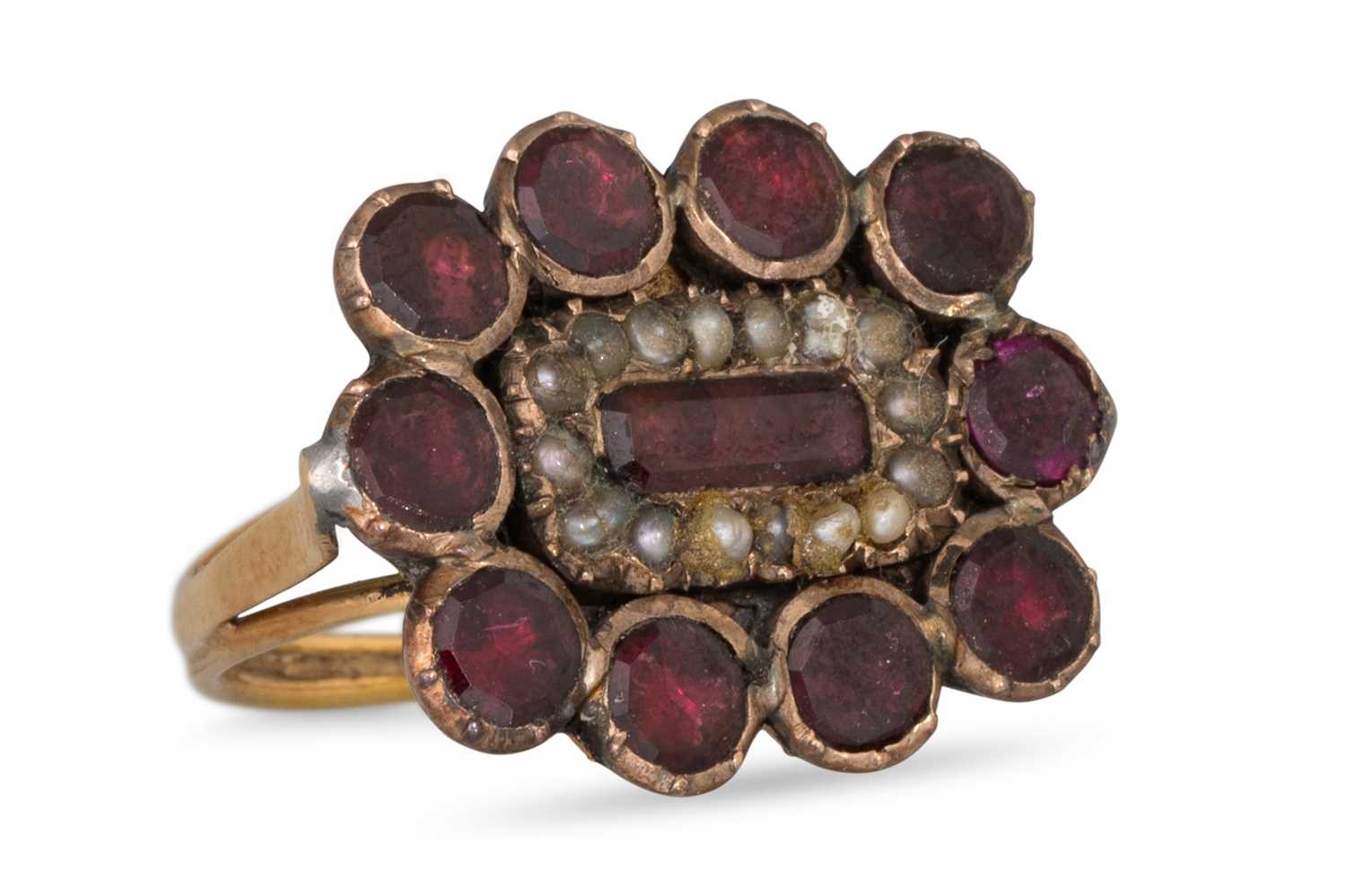 Lot 9 - AN ANTIQUE GARNET AND SEED PEARL RING, mounted...