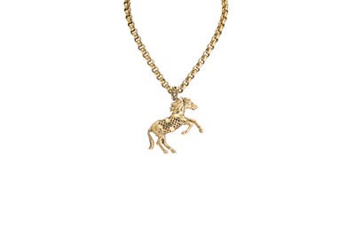 Lot 309 - A HEAVY 9CT GOLD EQUINE PENDANT, on a heavy...