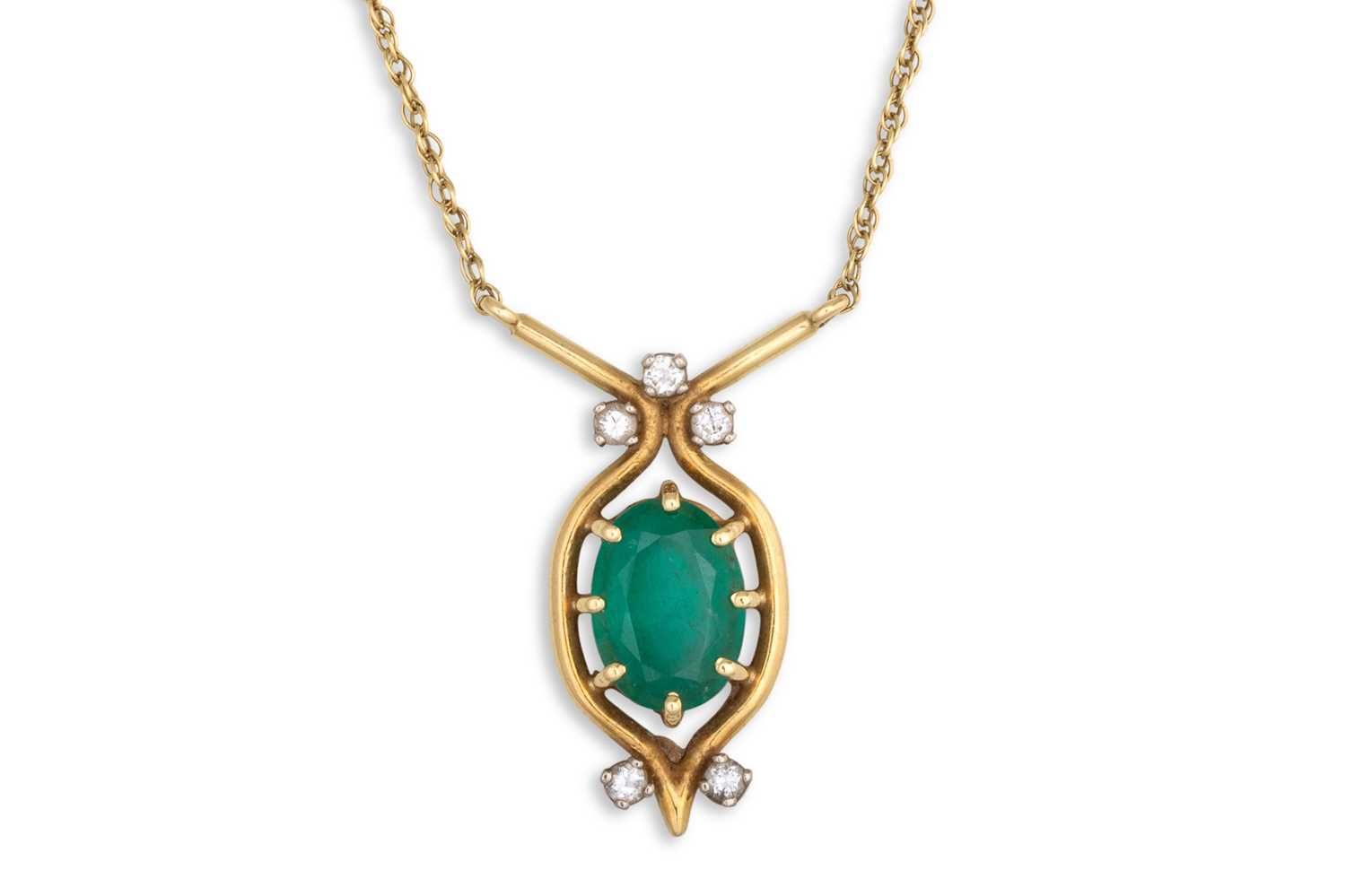 Lot 42 - AN EMERALD AND DIAMOND PENDANT, the oval cut...
