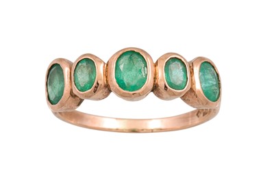 Lot 339 - A FIVE STONE EMERALD RING, collet set in 9ct...