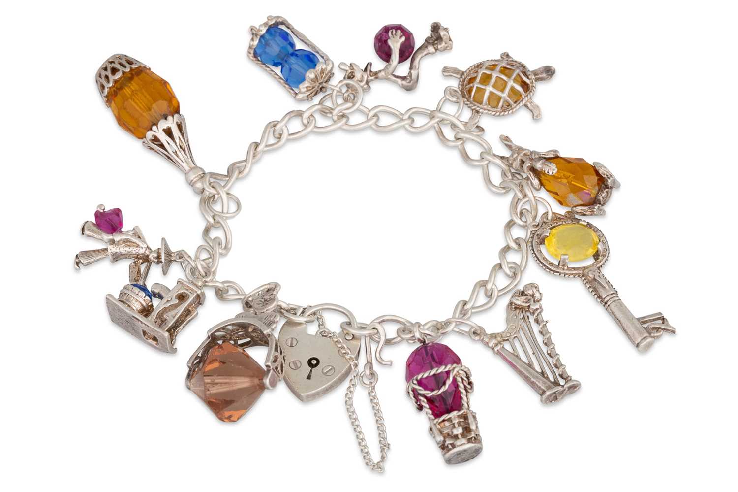 Lot 50 - A MODERN IRISH SILVER CHARM BRACELET, with...