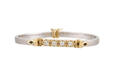 Lot 350 - A DIAMOND DOUBLE HINGED BANGLE, set with four...