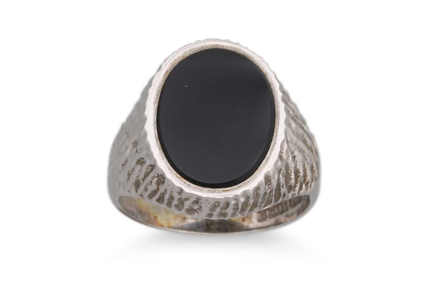 Lot 42 - A 1970'S ONYX SIGNET RING, mounted in silver...