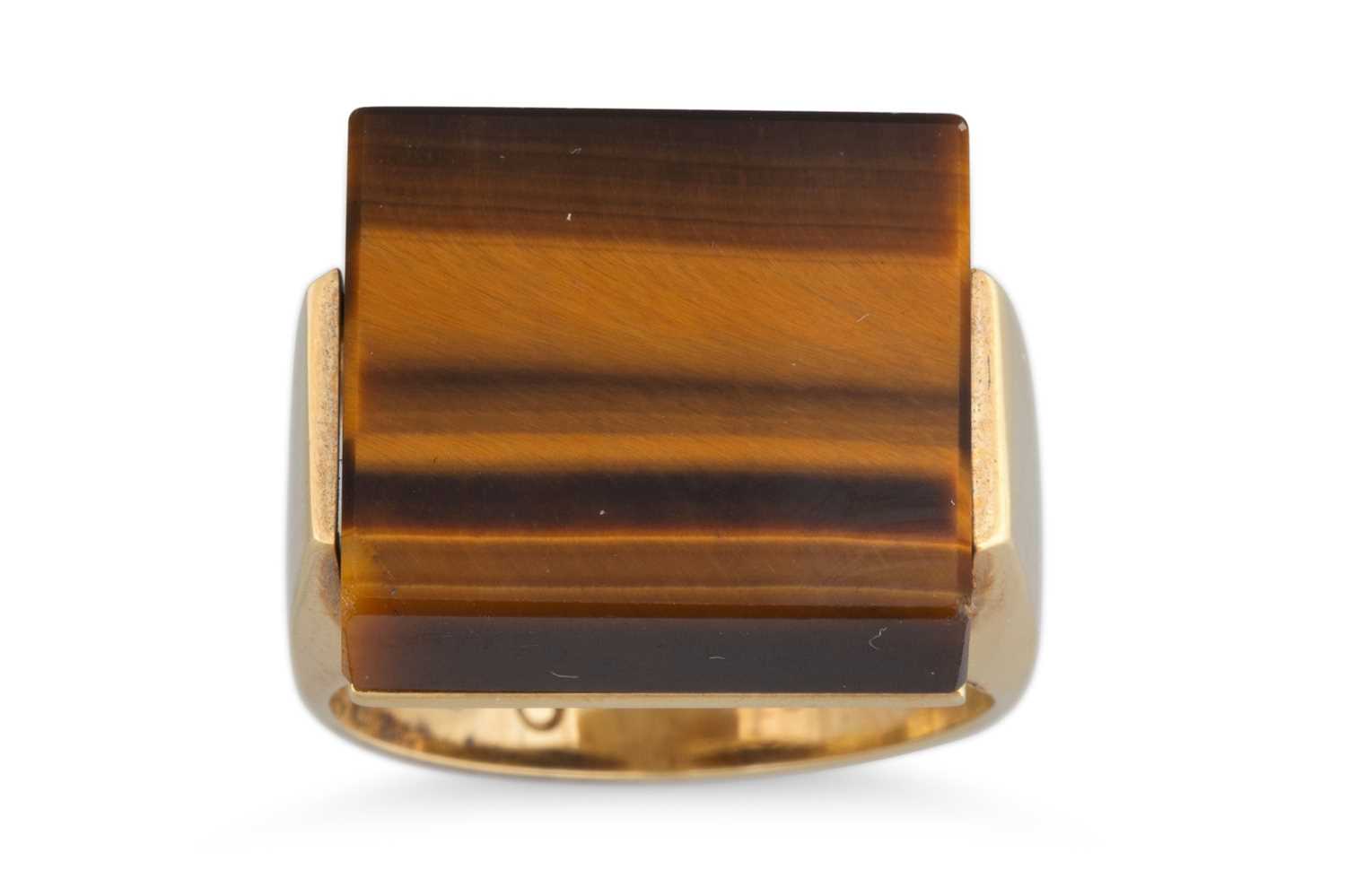 Lot 168 - A 1970'S TIGER'S EYE SET RING, of square form,...