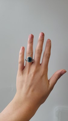 Lot 193 - A BLUE ZIRCON AND DIAMOND CLUSTER RING, by Kat...