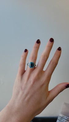 Lot 193 - A BLUE ZIRCON AND DIAMOND CLUSTER RING, by Kat...