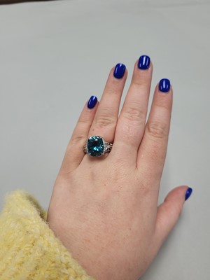 Lot 193 - A BLUE ZIRCON AND DIAMOND CLUSTER RING, by Kat...