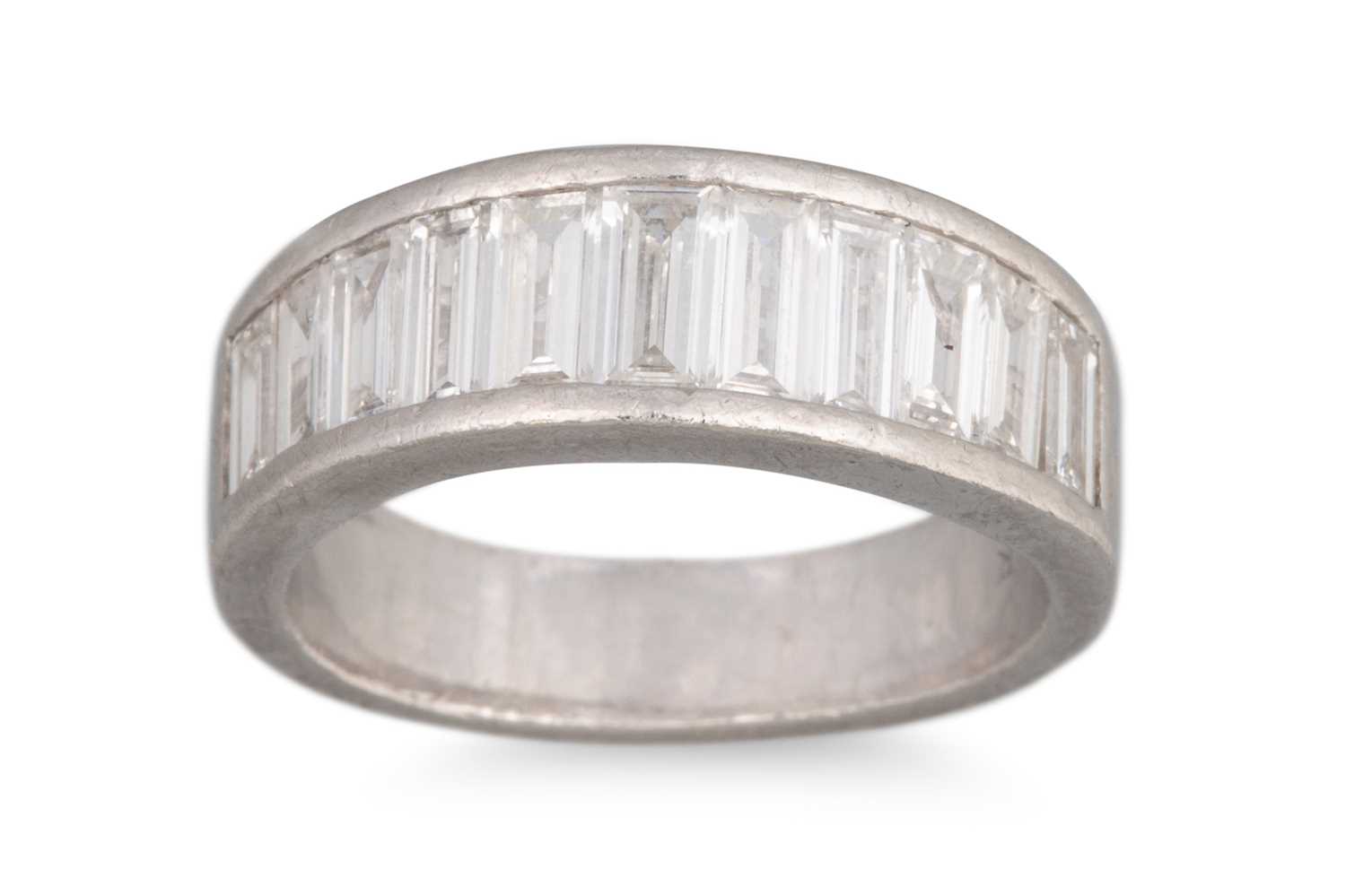 Lot 216 - A DIAMOND HALF ETERNITY RING, the graduated...