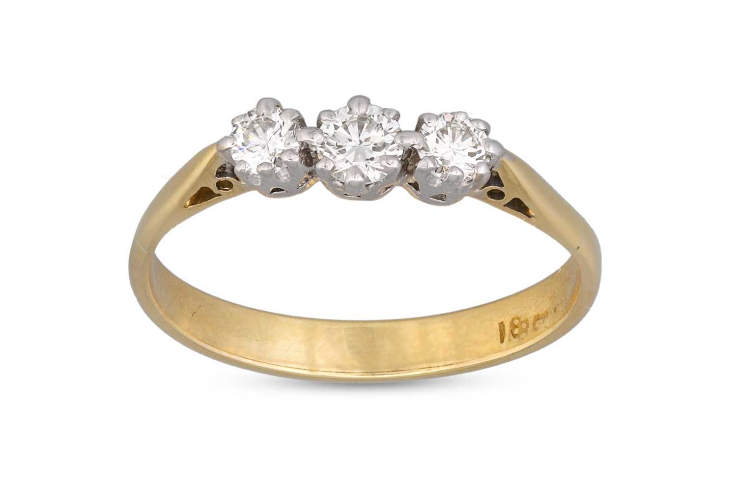 Lot 40 - A DIAMOND THREE STONE RING, the round...