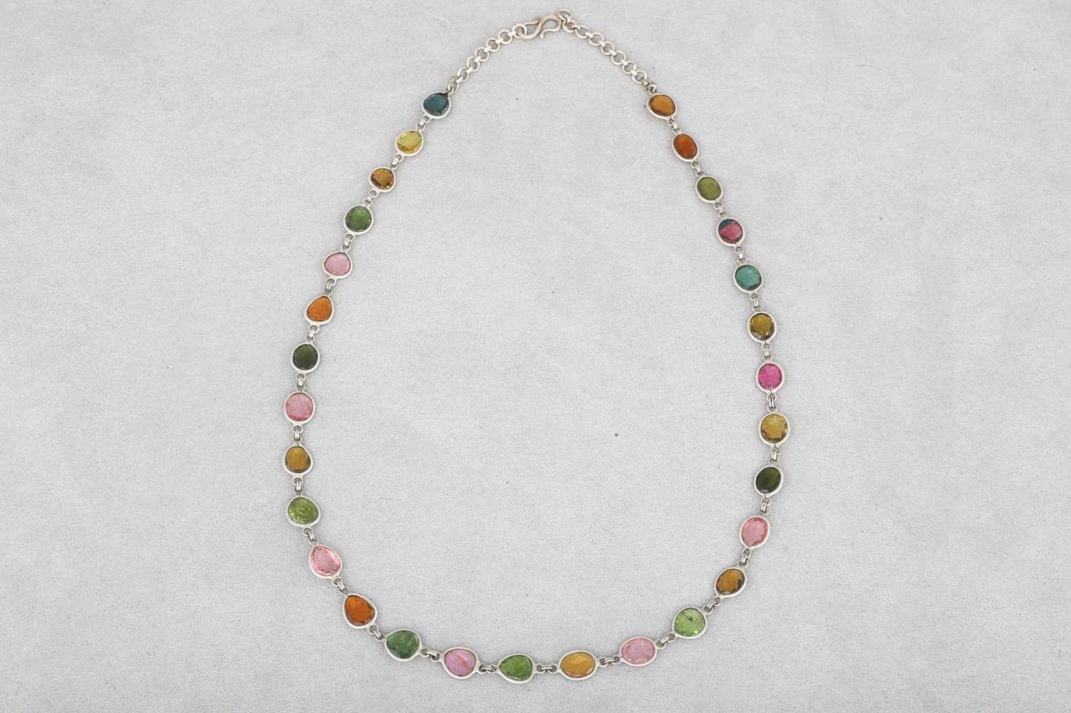 Lot 64 - A MULTI-GEM SET NECKLACE, set in silver, set...