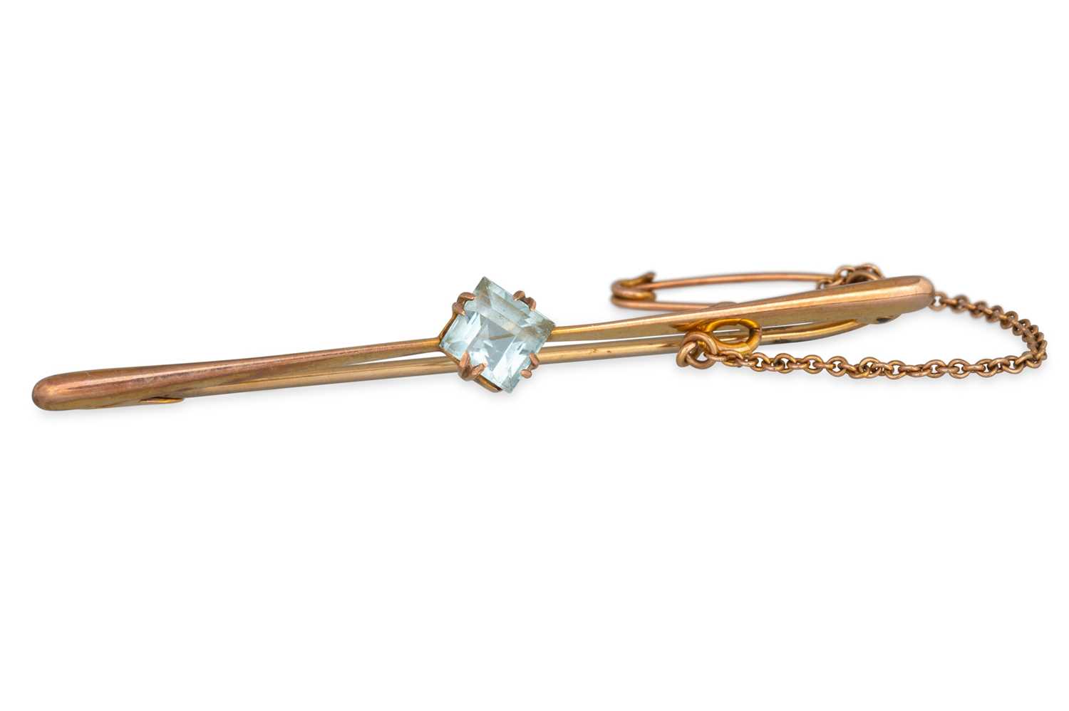 Lot 14 - A 9CT GOLD BAR BROOCH, set with synthetic...