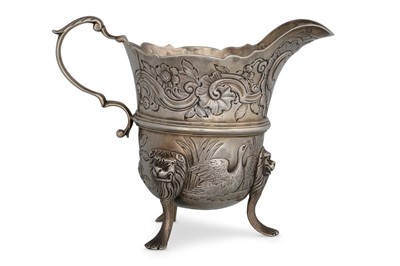 Lot 481 - AN IRISH GEORGIAN STYLE CREAM JUG, chaised and...