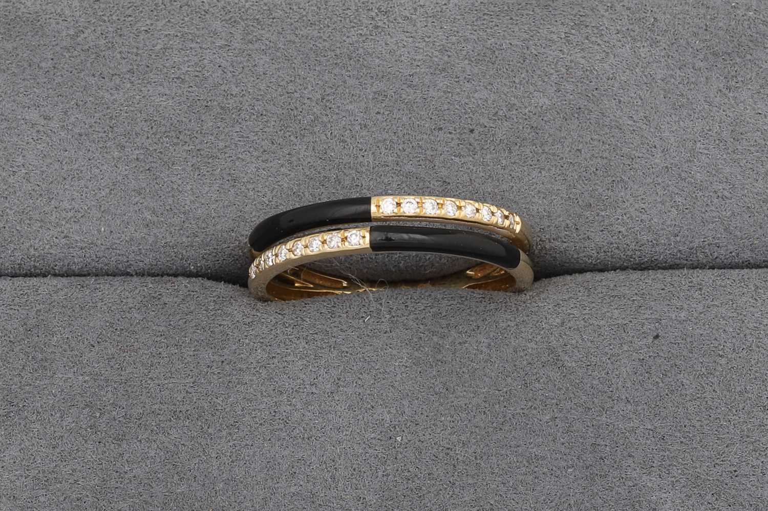Lot 66 - A TWO ROWED ONYX AND DIAMOND RING, mounted in...