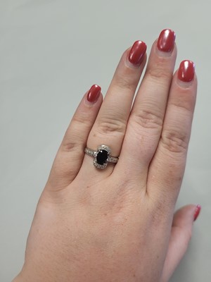 Lot 67 - A SMOKEY QUARTZ RING, to diamond shoulders,...