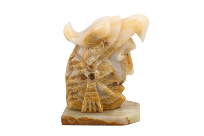 Lot 472 - A BANDED AGATE SCULPTURE OF A HELMETED WARRIOR,...