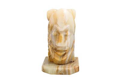 Lot 472 - A BANDED AGATE SCULPTURE OF A HELMETED WARRIOR,...