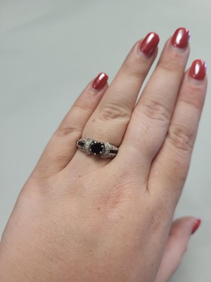 Lot 72 - A SAPPHIRE AND DIAMOND DRESS RING, mounted in...