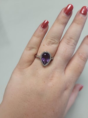 Lot 74 - AN AMETHYST AND DIAMOND CLUSTER RING,...