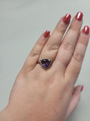 Lot 75 - AN AMETHYST AND DIAMOND CLUSTER RING, of...