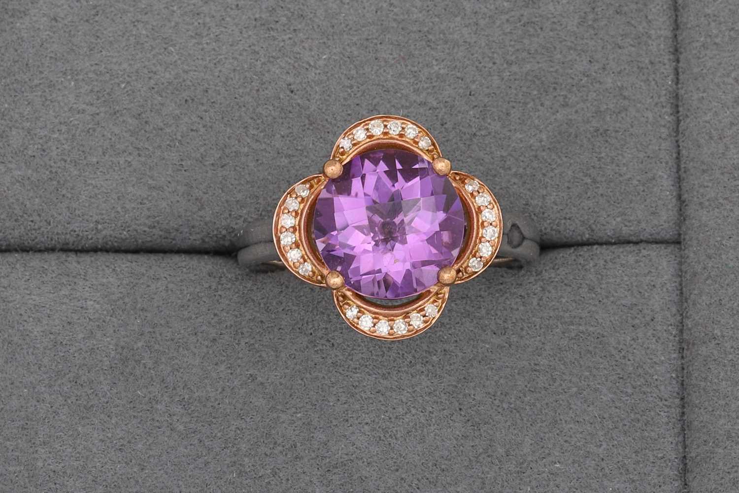 Lot 76 - AN AMETHYST AND DIAMOND CLUSTER RING, of...