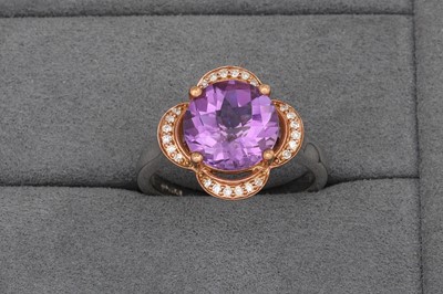 Lot 76 - AN AMETHYST AND DIAMOND CLUSTER RING, of...