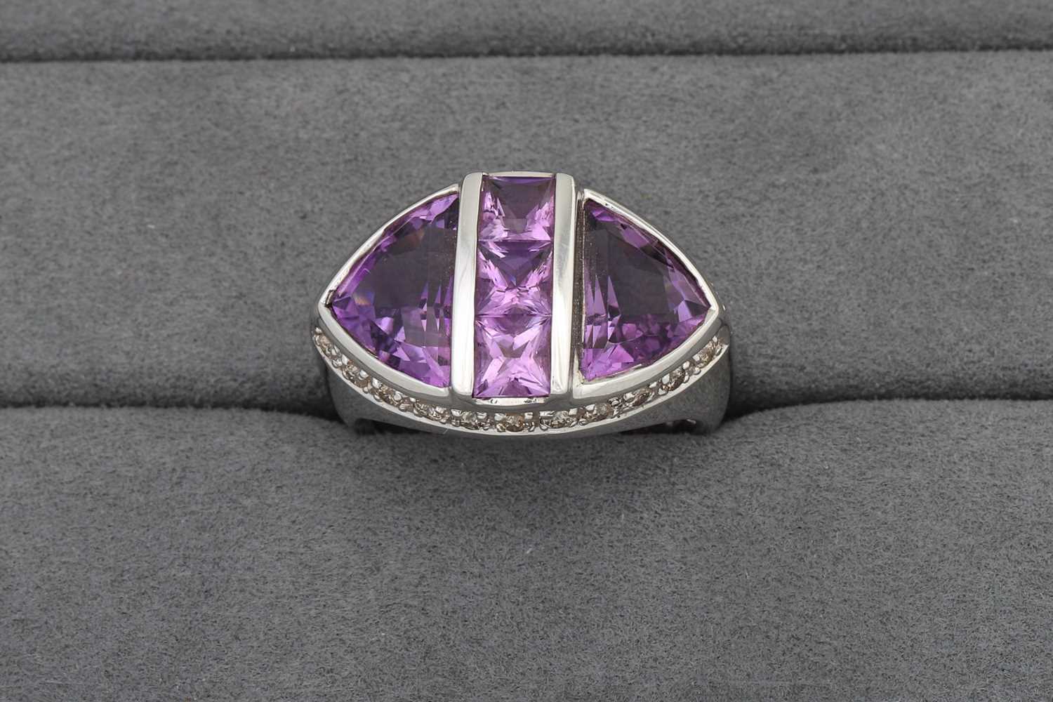 Lot 79 - AN AMETHYST AND DIAMOND CLUSTER RING, mounted...