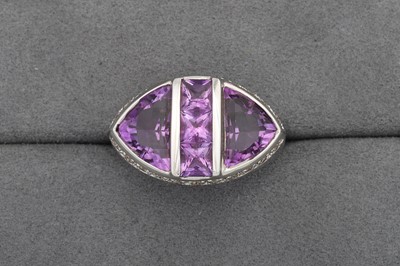 Lot 79 - AN AMETHYST AND DIAMOND CLUSTER RING, mounted...