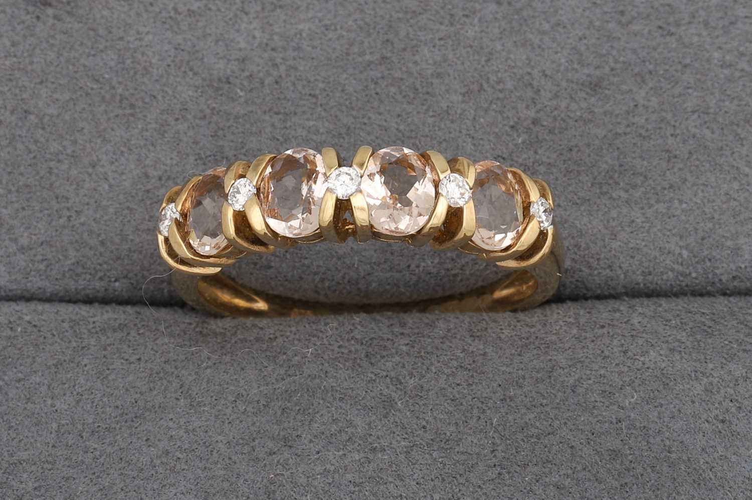 Lot 96 - A MORGANITE AND DIAMOND BAND RING, mounted in...