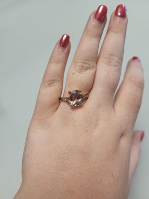 Lot 85 - A MORGANITE RING, to diamond shoulders,...