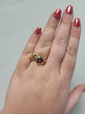 Lot 91 - A PINK TOPAZ AND DIAMOND RING, of crossover...