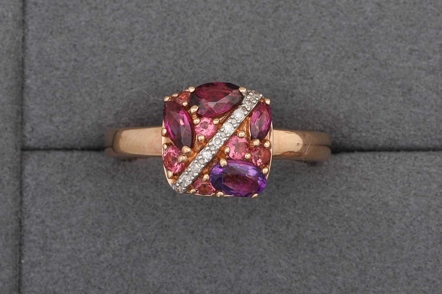 Lot 94 - AN AMETHYST AND DIAMOND CLUSTER RING, mounted...