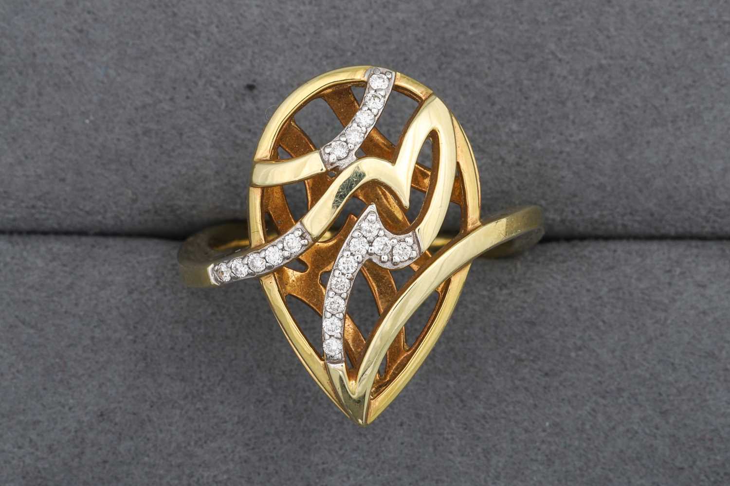 Lot 100 - A DIAMOND SET RING, of open work pear shaped...