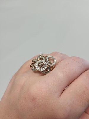 Lot 102 - AN UNUSUAL DIAMOND CLUSTER RING, intersecting...
