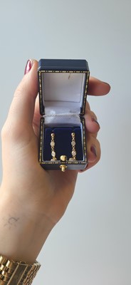 Lot 16 - A PAIR OF DIAMOND DROP EARRINGS, the bezel set...