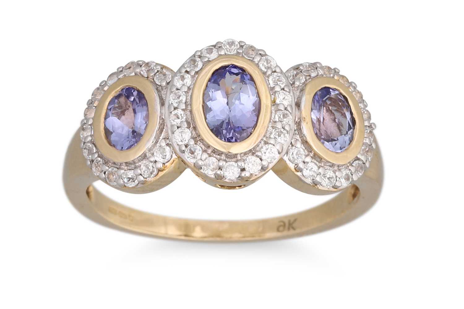 Lot 19 - A THREE STONE CLUSTER RING, set with...