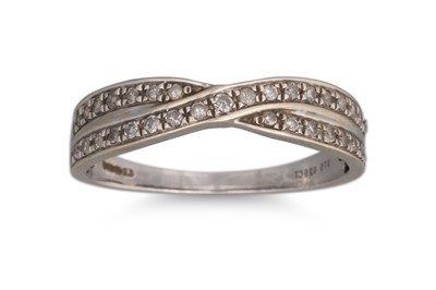 Lot 48 - A DIAMOND SET CROSSOVER DRESS RING, set with...