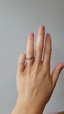Lot 48 - A DIAMOND SET CROSSOVER DRESS RING, set with...