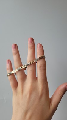 Lot 4 - A 9CT YELLOW GOLD CUBIC ZIRCONIA SET PANEL...