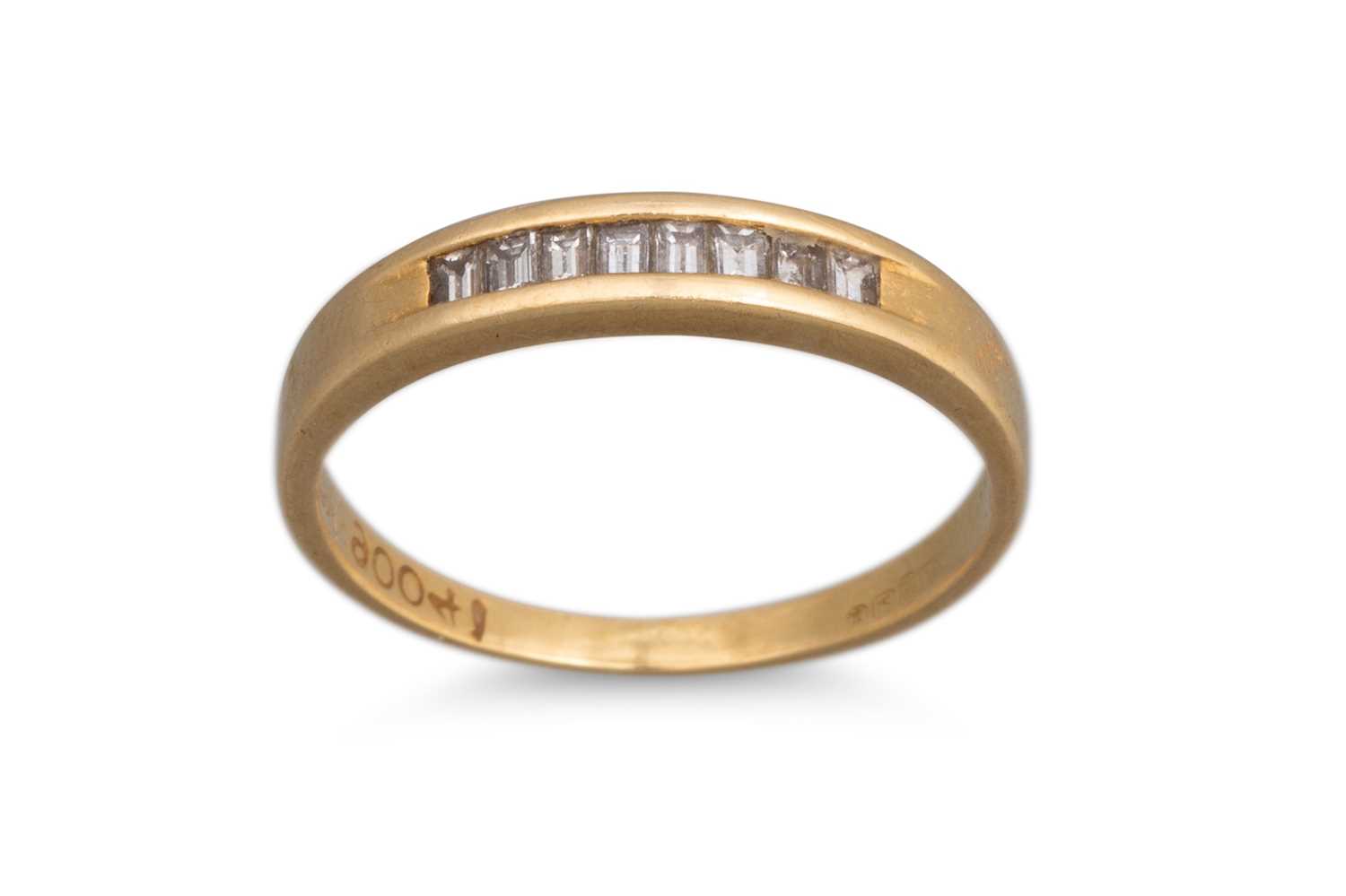 Lot 5 - A DIAMOND HALF ETERNITY RING, the baguette cut...